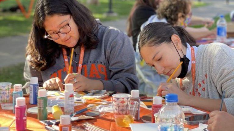 students painting